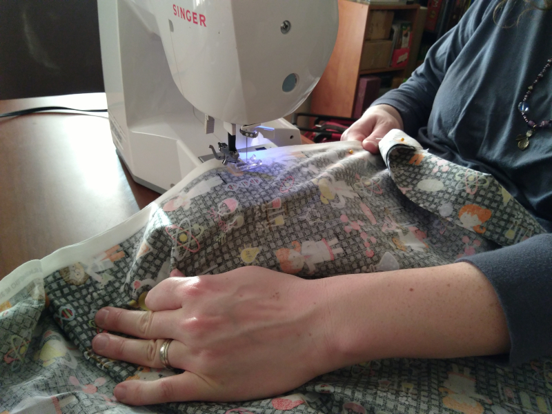Christine using the sewing machine